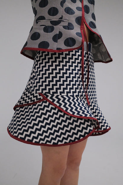 THE ZIGZAG ASYMMETRICAL MINI SKIRT WITH BURGUNDY TRIM