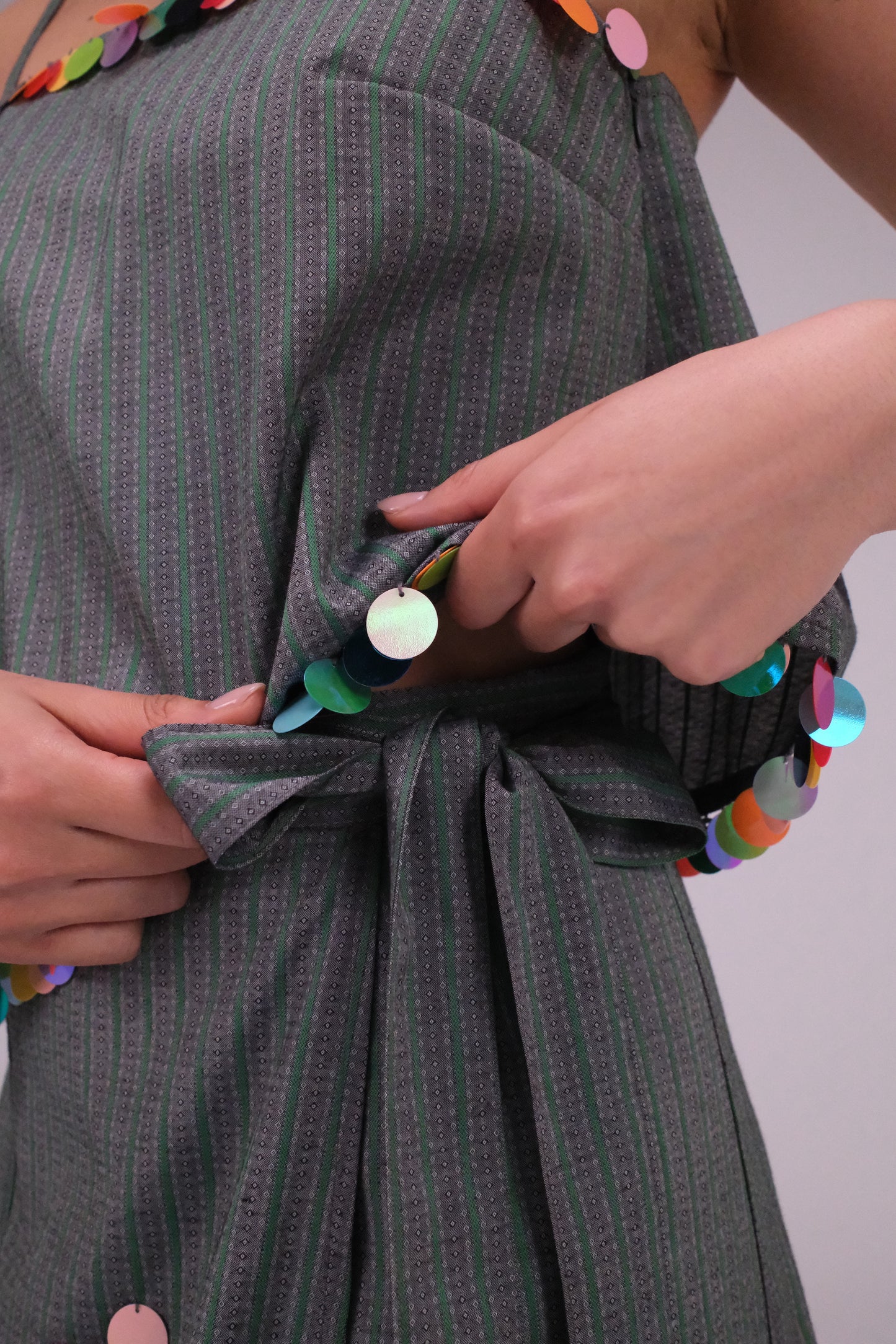 THE GREEN STRIPED TOP WITH COINS