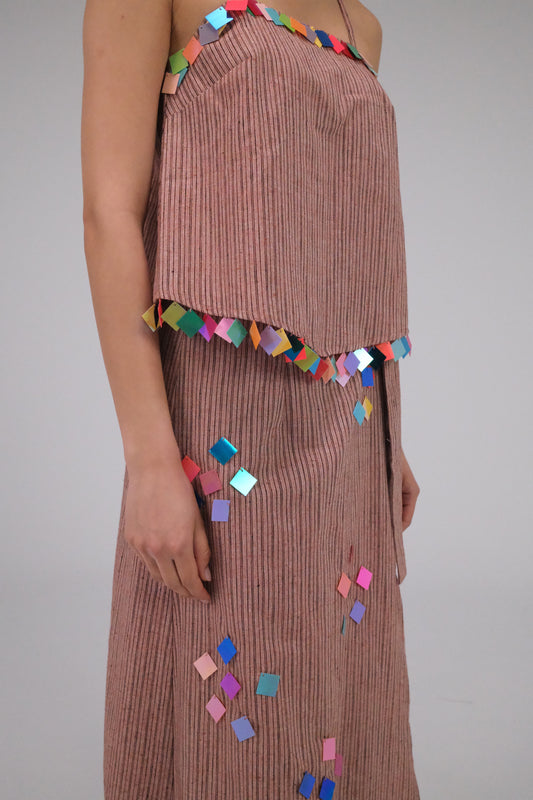 THE LIGHT ORANGE TOP WITH COINS