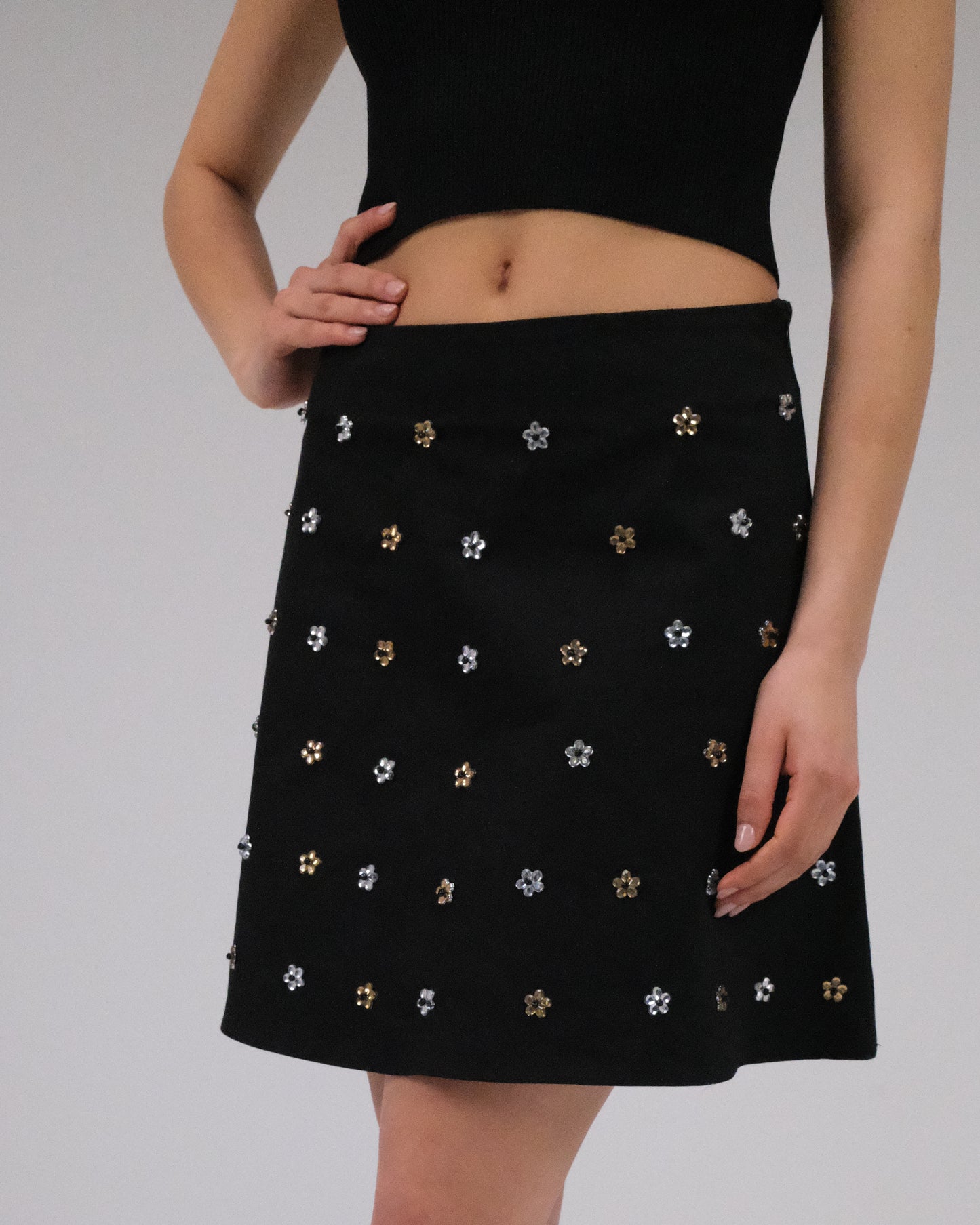 THE BLACK GABARDINE ALINE MINI SKIRT WITH FLOWER CRYSTALS