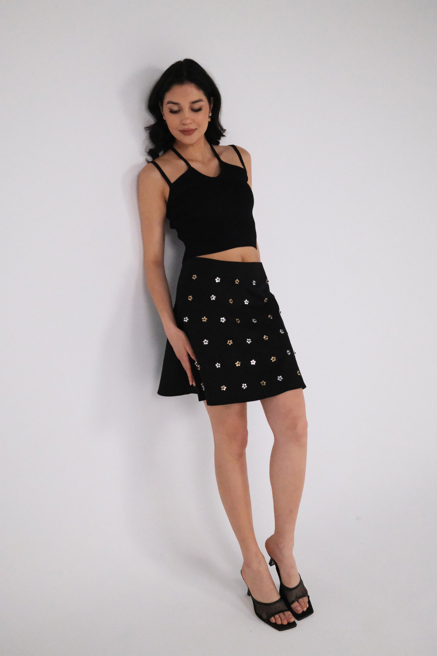 THE BLACK GABARDINE ALINE MINI SKIRT WITH FLOWER CRYSTALS